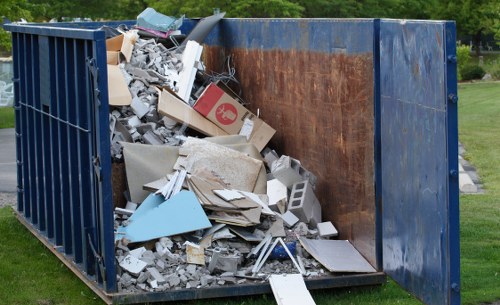 Electric refuse van parked at a local transfer station for sustainable collections
