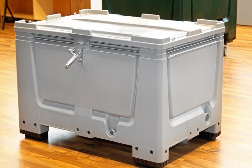 Segregated bins for glass, paper and food waste outside a Barnet office